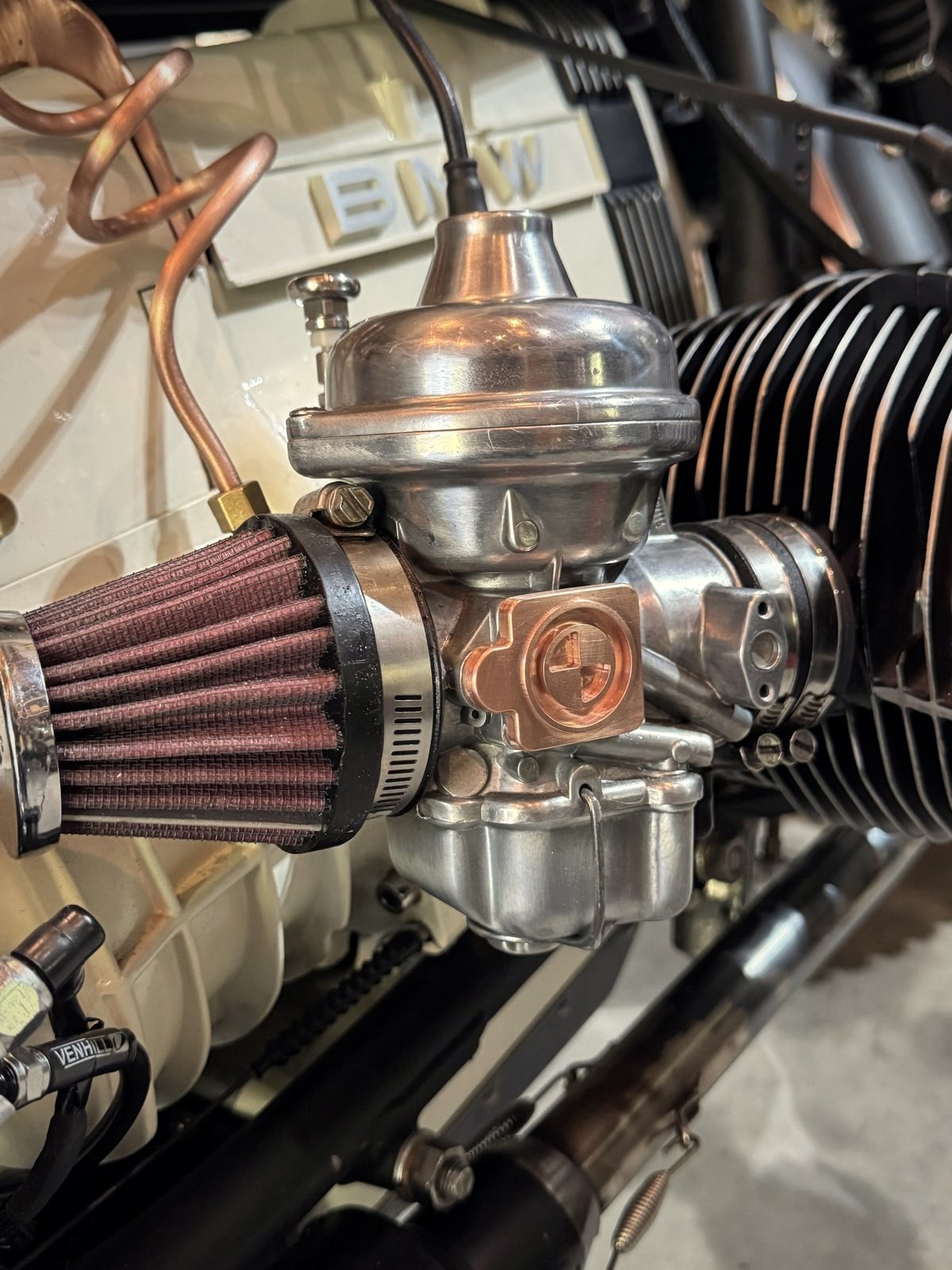 Close-up of a Bing carburettor with a pod filter on a BMW boxer cylinder